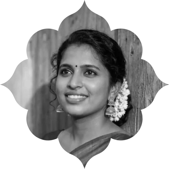 Shreya, smiling, jasmine in her hair